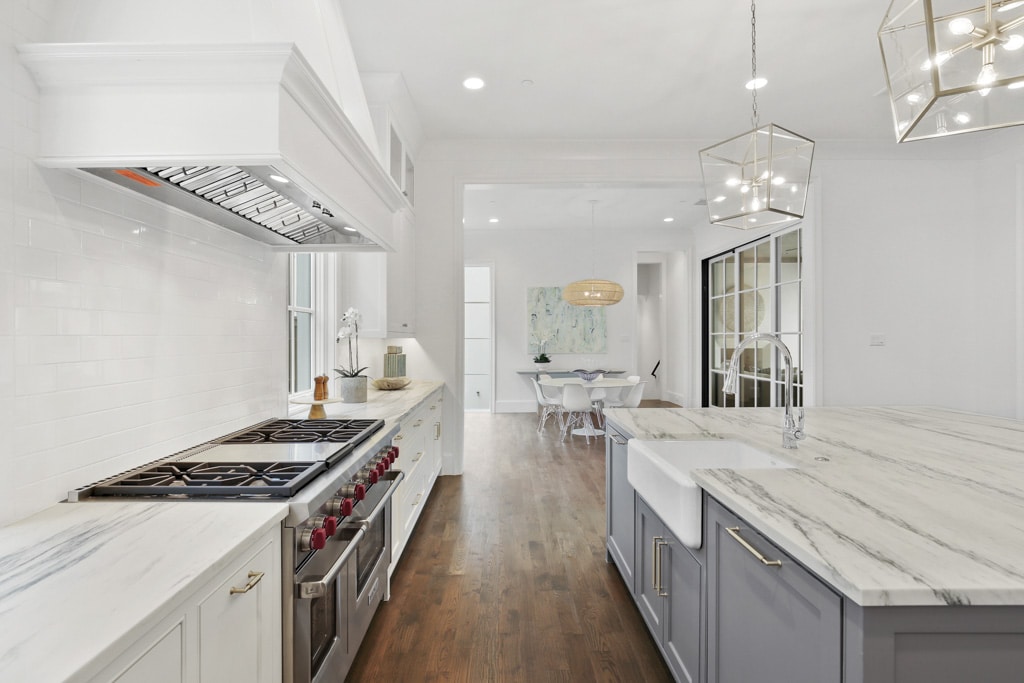 Freshly redesigned and remodeled kitchen with stark white walls and countertops