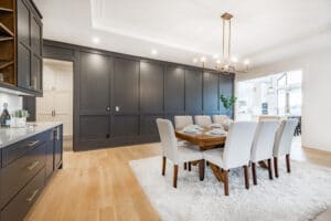Elegant,And,Large,Staged,Dining,Room,With,Dark,Cabinets,And